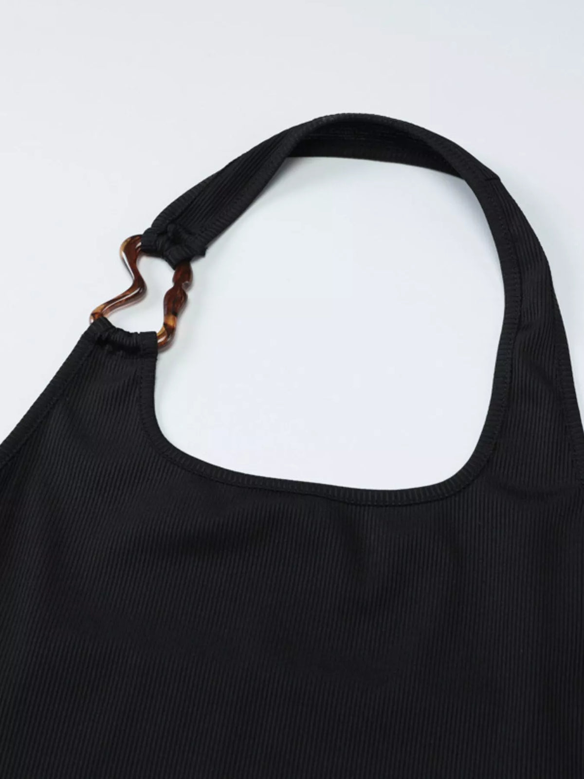 Bare back view of the black halter neck tank top