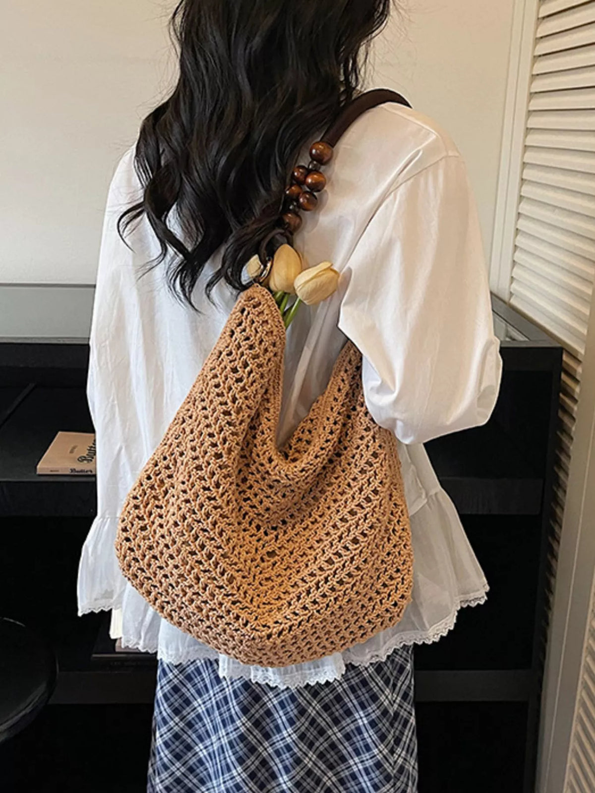 Knitted shoulder bag styled with summer outfit