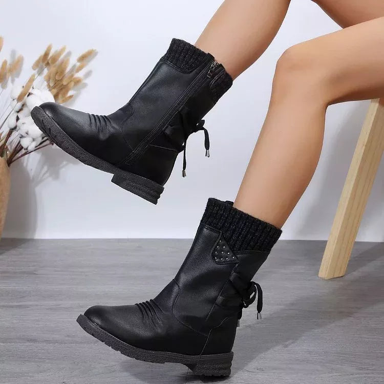 Purple knitted cuff round toe boots angled three quarter view
