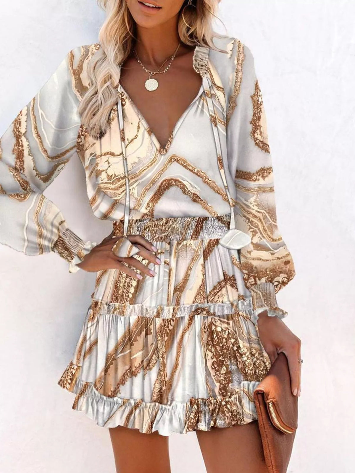 Tie neck lantern sleeve tiered dress detail view