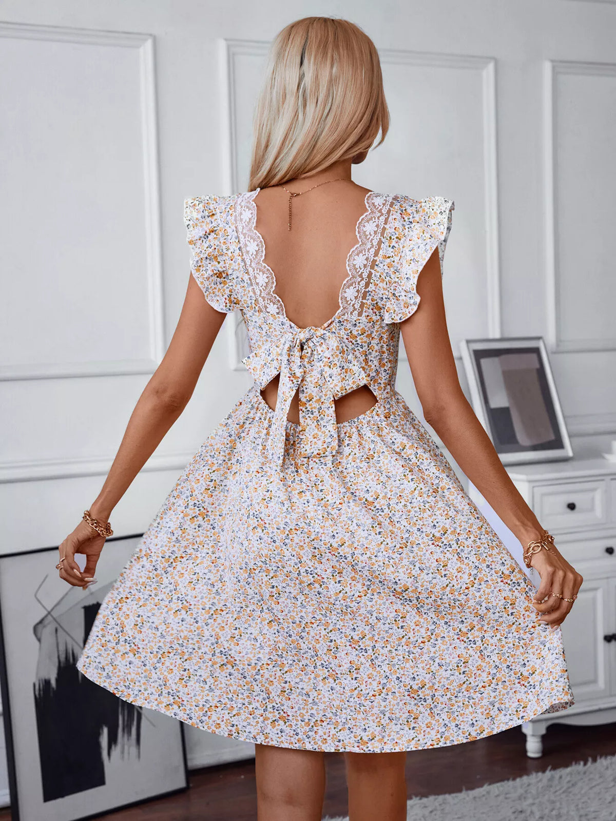 Floral dress shown from the back with the tie fastening