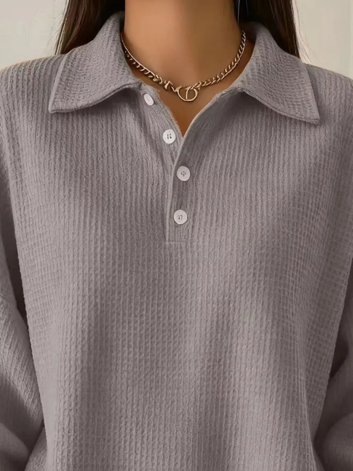 Button detail top worn with jeans