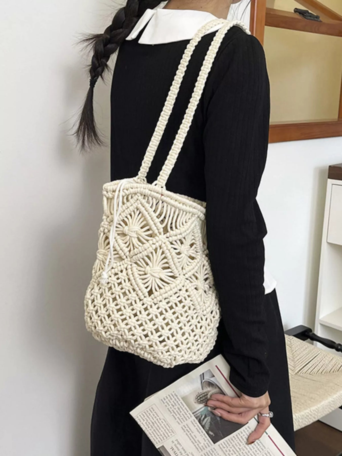 Model carrying crochet bucket bag