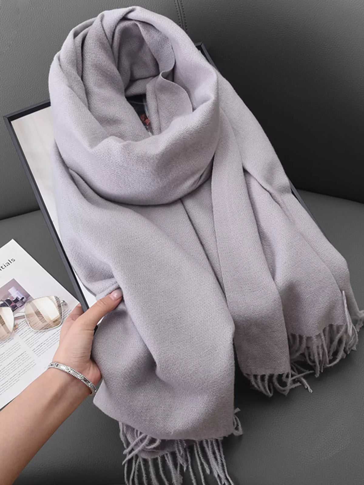 Solid color fringe scarf styled look