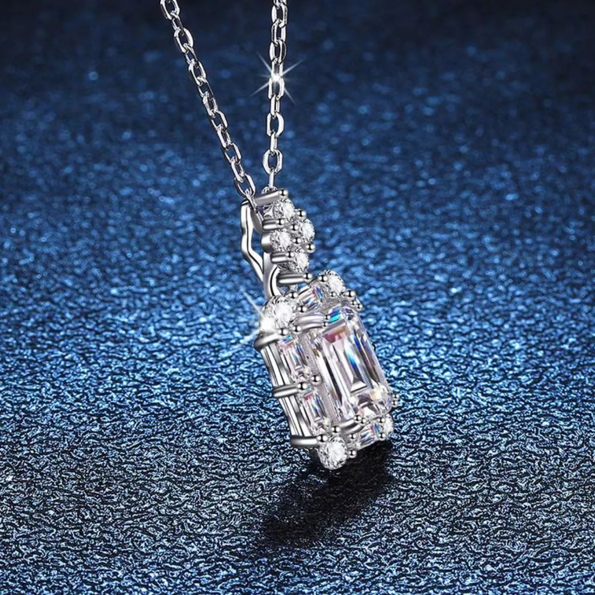 Side view of the halo pendant and stone set bail