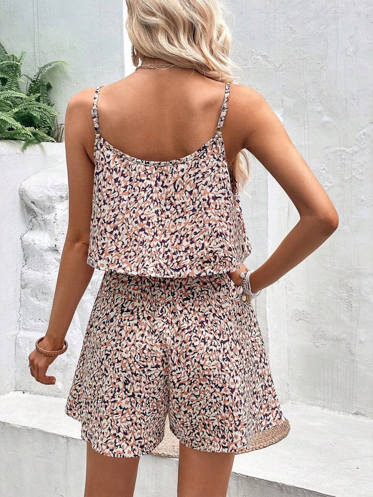 Brown printed spaghetti strap romper full length view