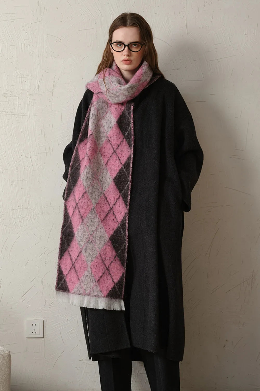 Close up of the argyle pattern and fringe detail
