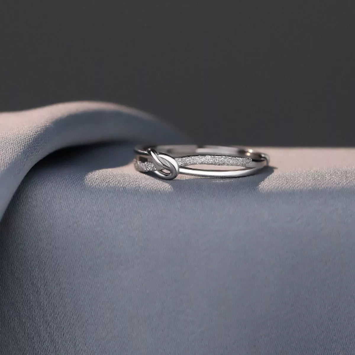 Sterling silver zircon knot ring side view