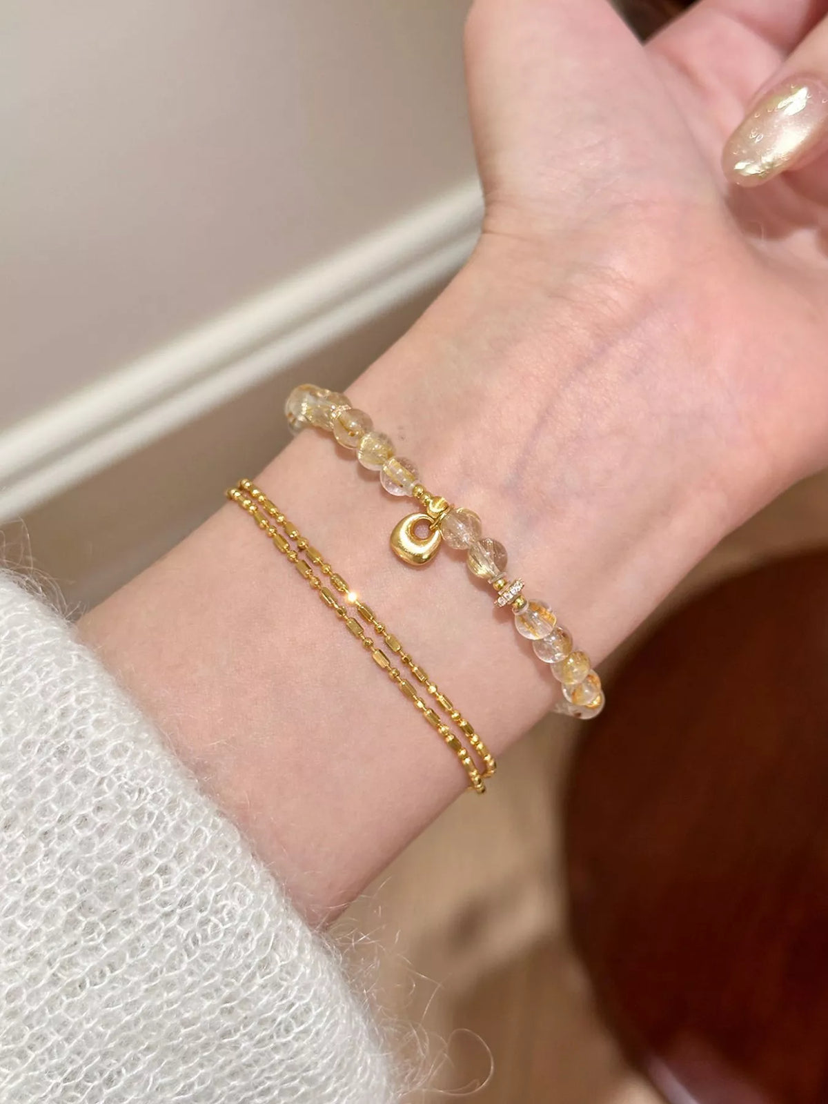 Dainty gold beaded bracelet styled on the wrist