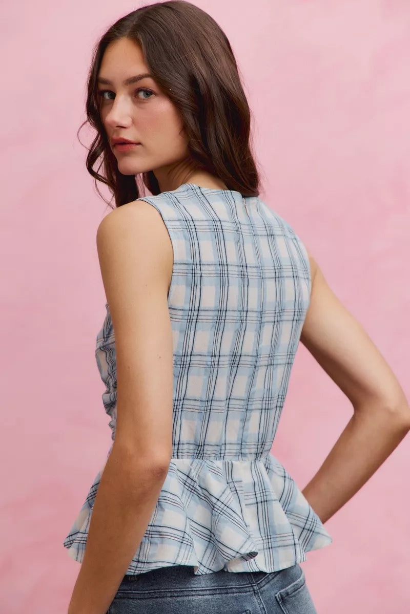 Blue plaid sleeveless ruffle peplum top front view