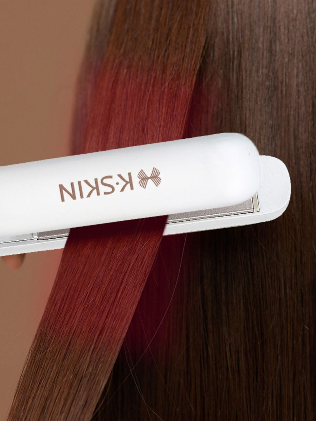 Mini straightener styling a strand of hair