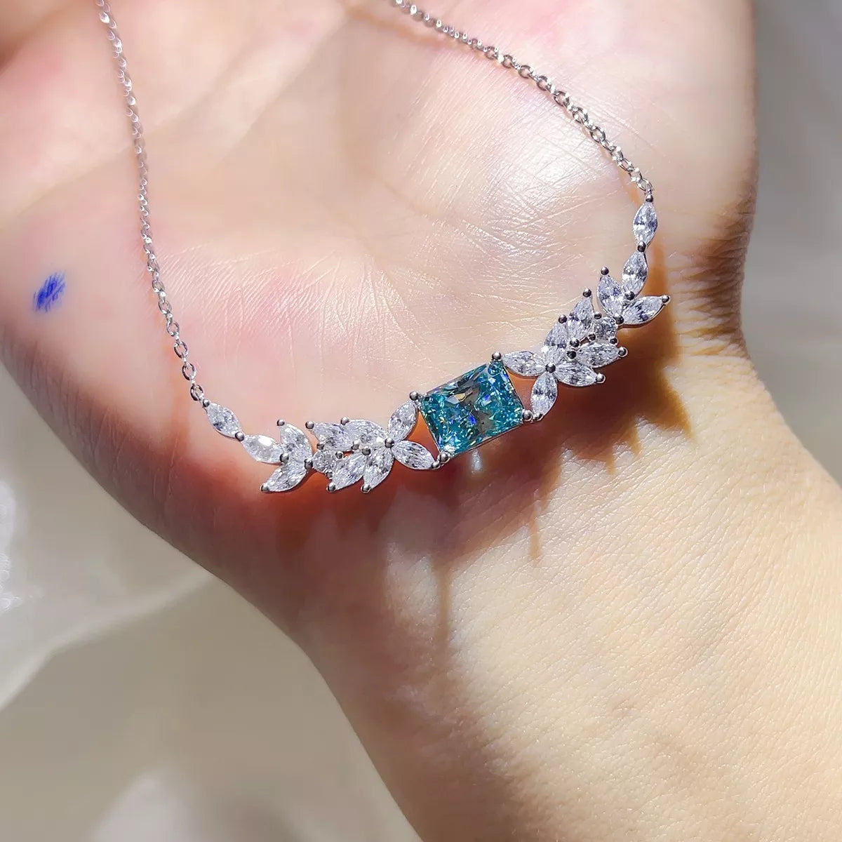 Close up of moissanite stone in silver setting