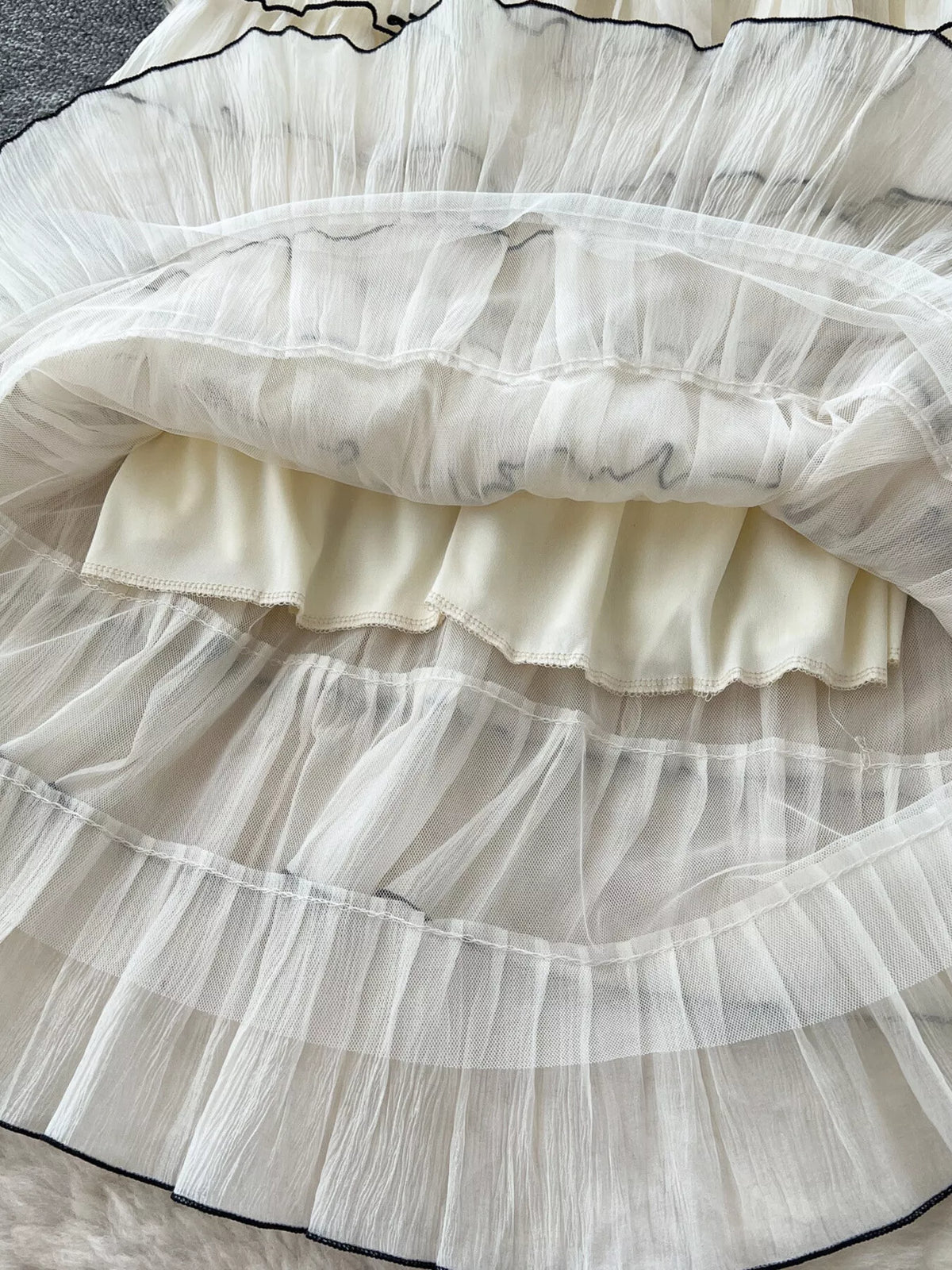 Full length view of ruffled contrast trim skirt