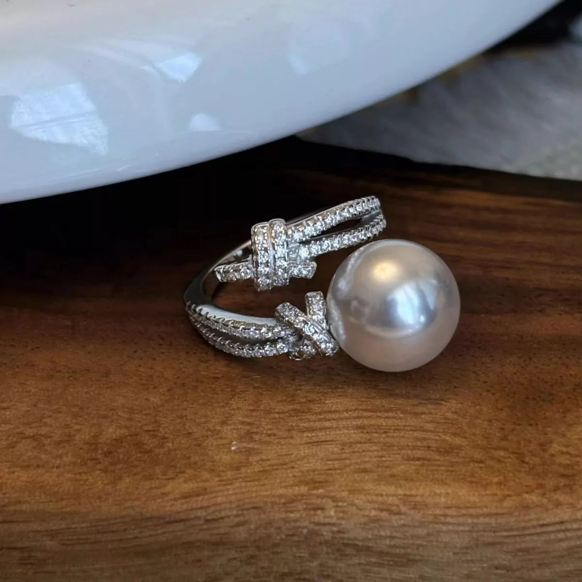 pearl and zircon bypass ring in sterling silver side view