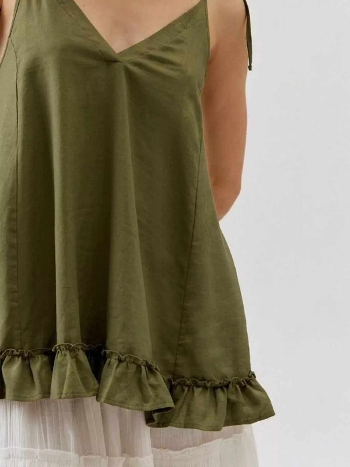 Tie strap ruffle hem cami close up view