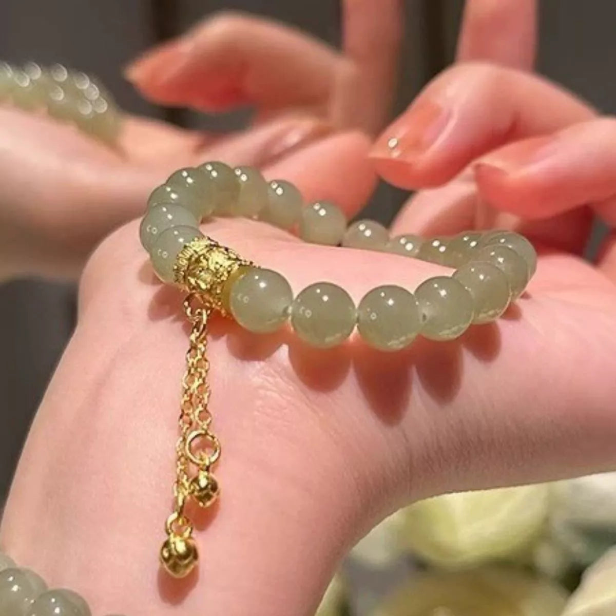 Green jade beaded bracelet clasp detail