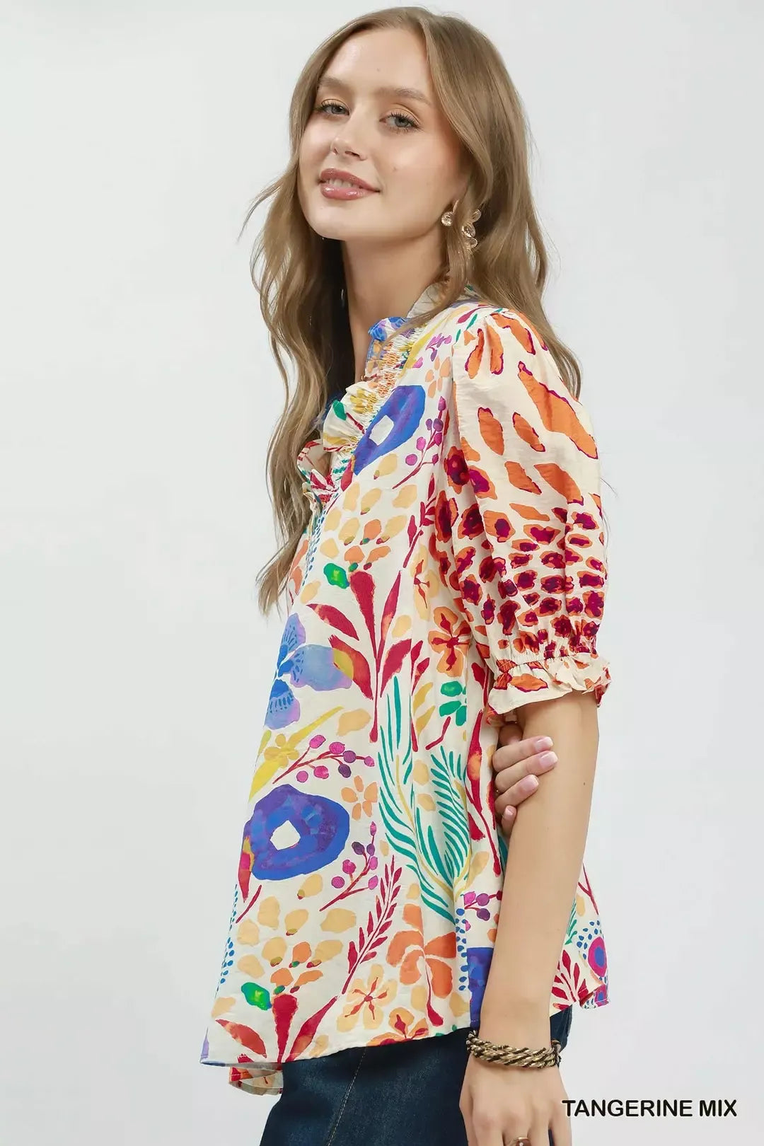 Tangerine V neck ruffle trim puff sleeve top front view