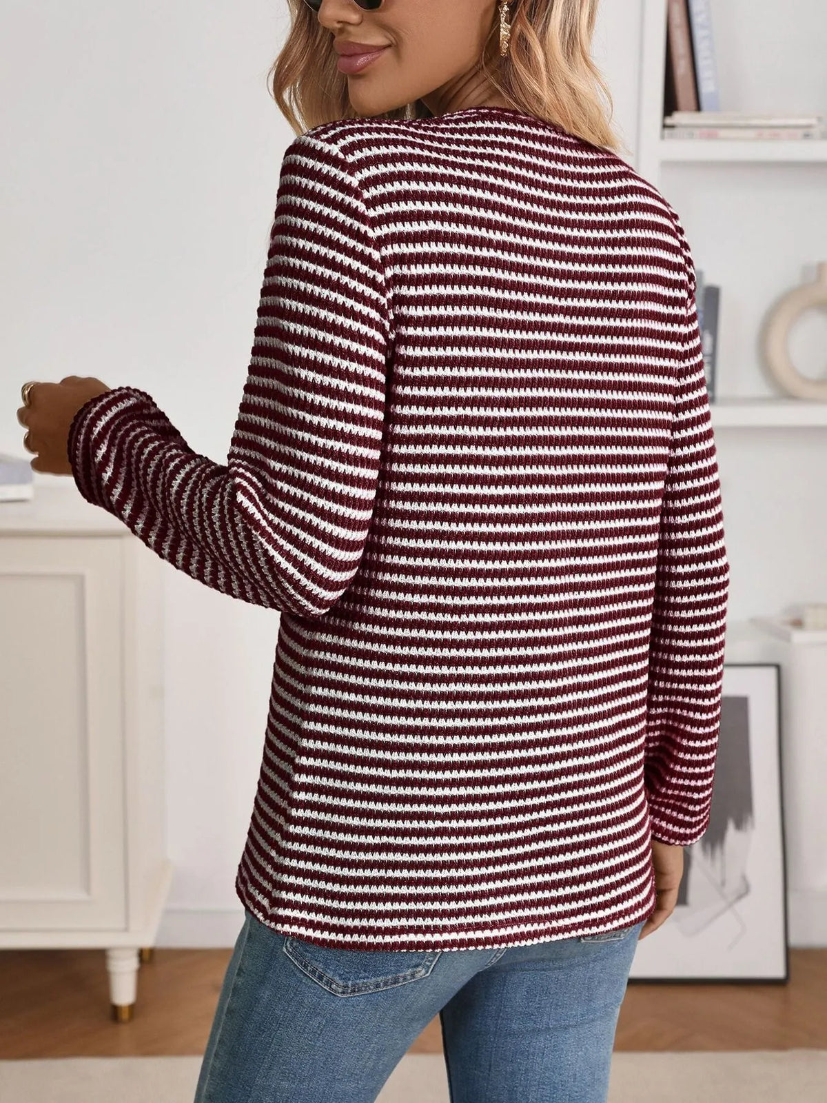 Striped long sleeve top button detail close up