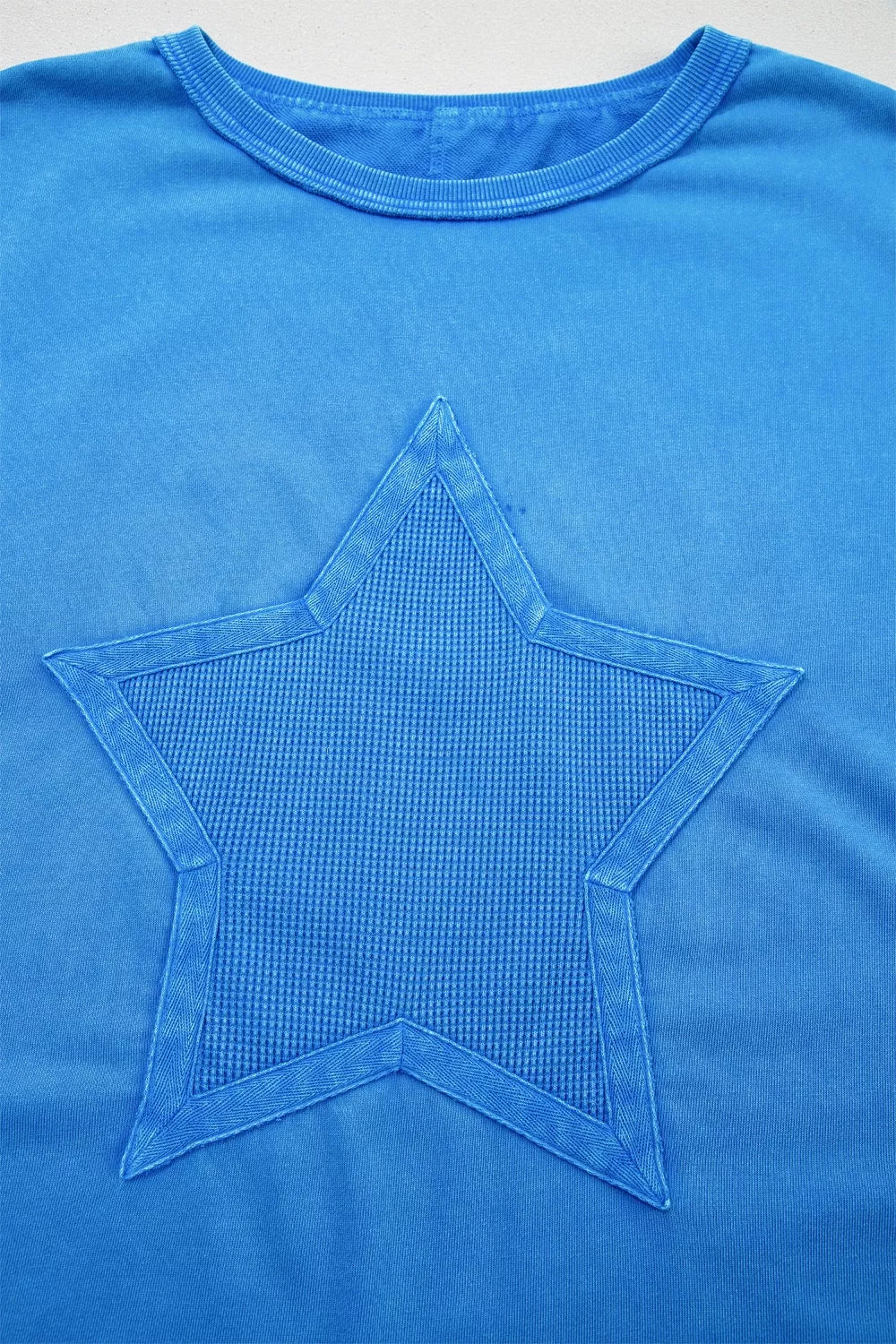 Blue mineral wash star patchwork oversize tee close up detail