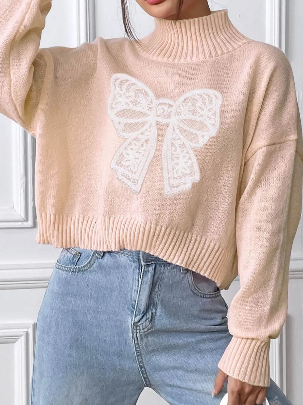 Cozy bow turtleneck sweater neckline detail