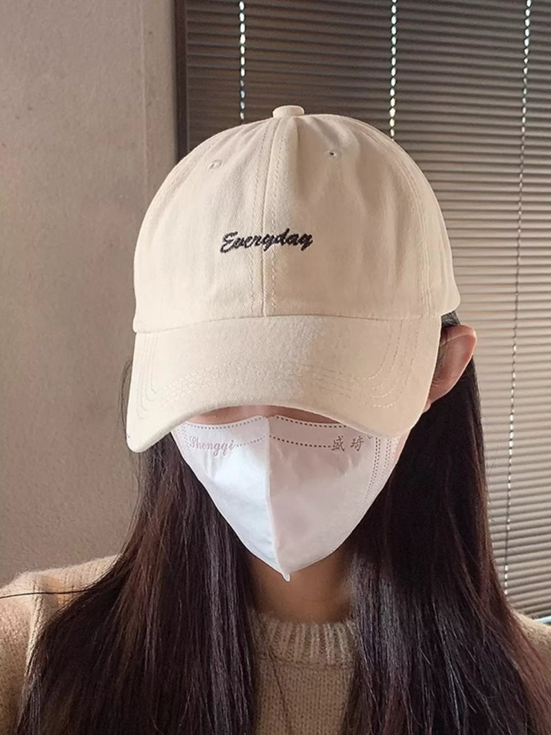 Embroidered casual baseball cap in beige front view