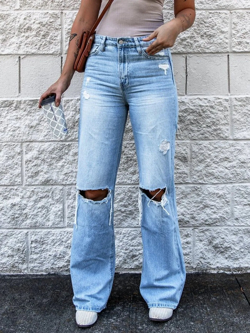 High waist distressed light blue jeans front view