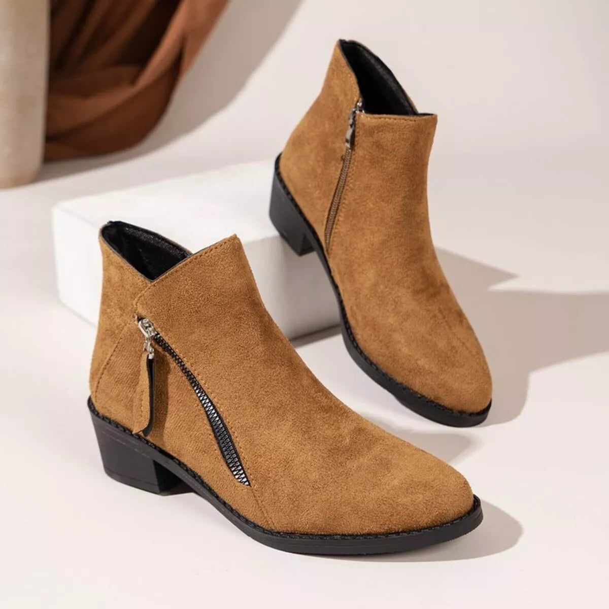 Caramel point toe block heels boots top down view