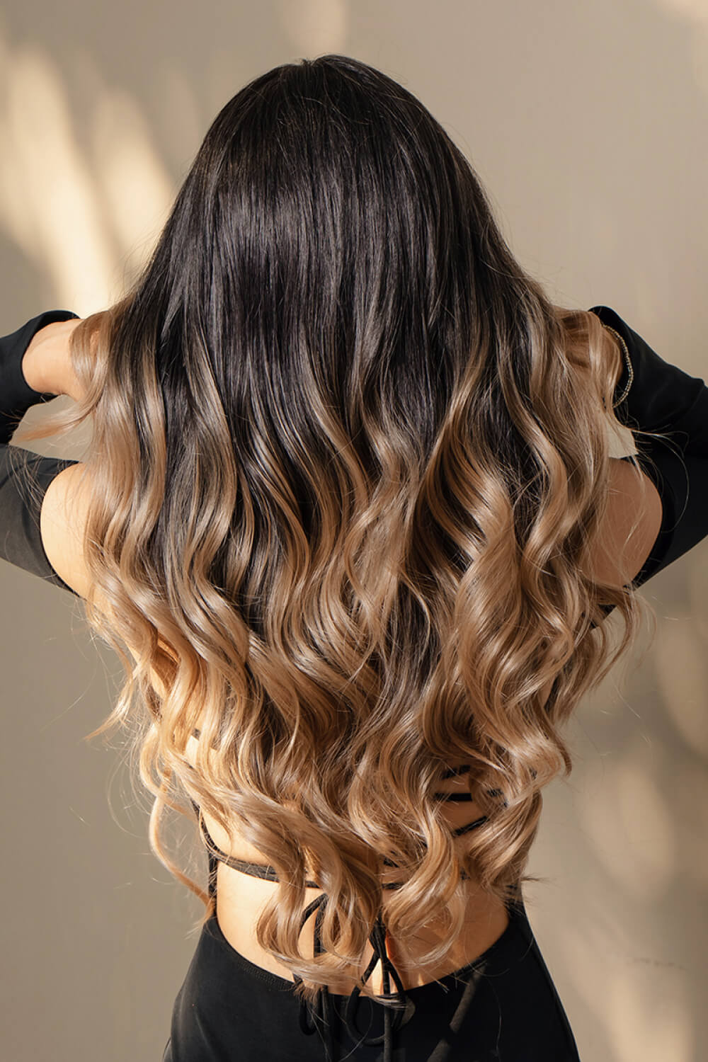 Side profile of long wavy synthetic lace front wig