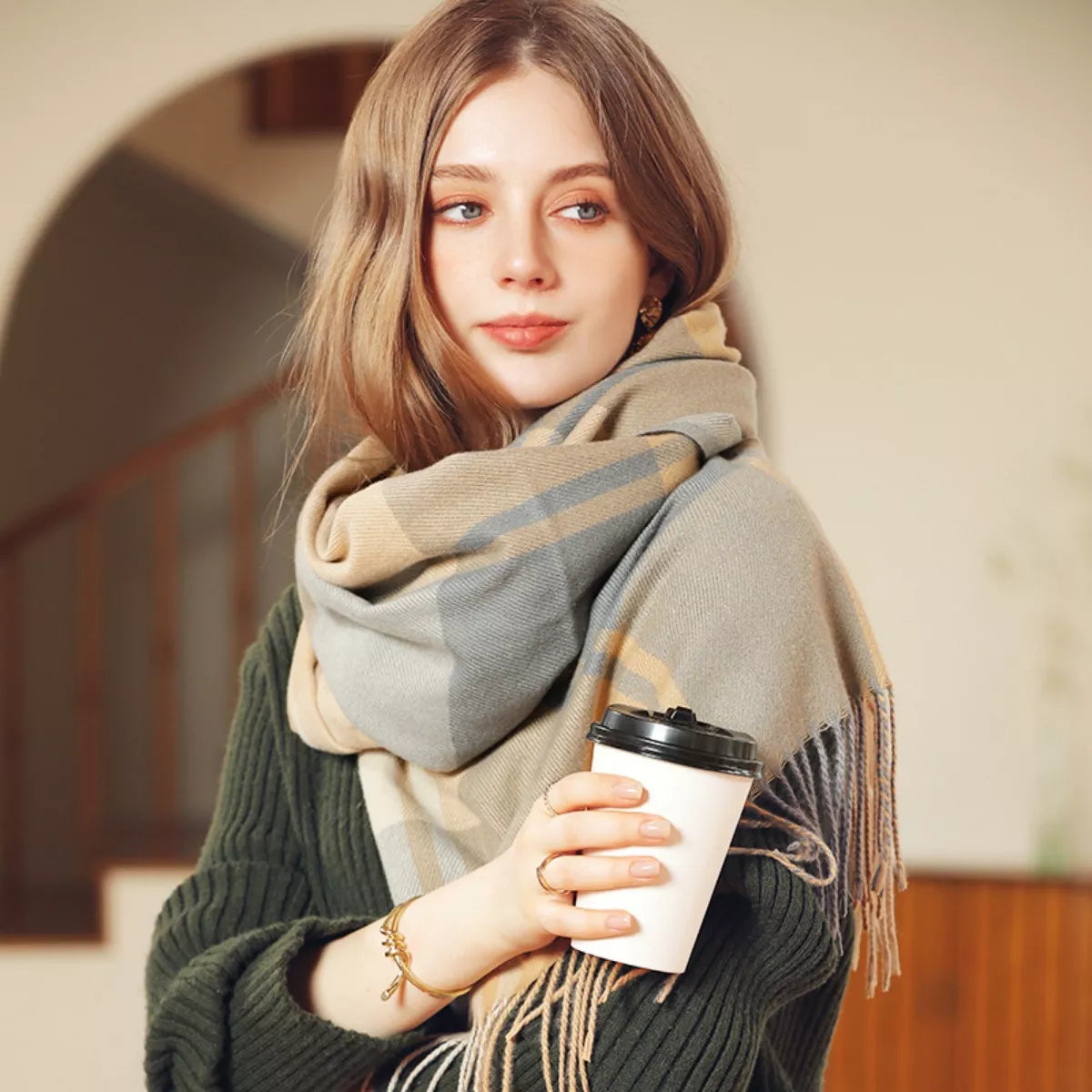 Plaid fringe scarf laid flat to show the pattern