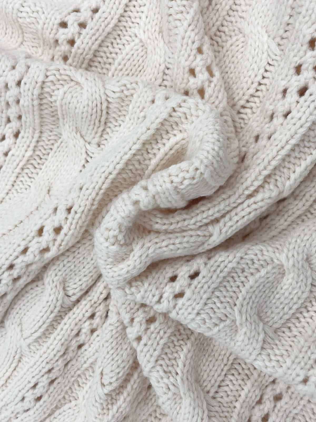 Cable knit belted button front cardigan, close up detail