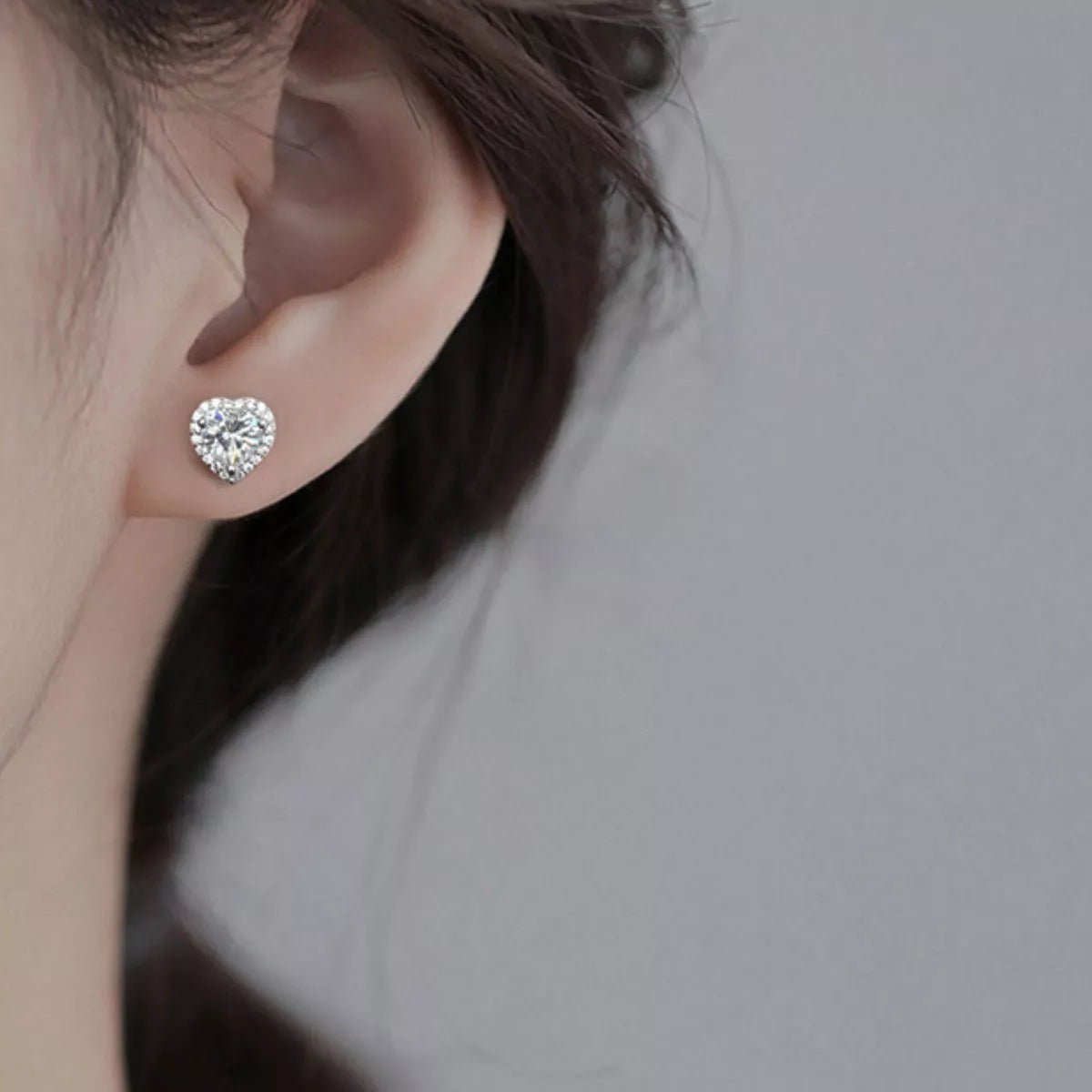 Heart shaped moissanite sterling silver stud earrings front view