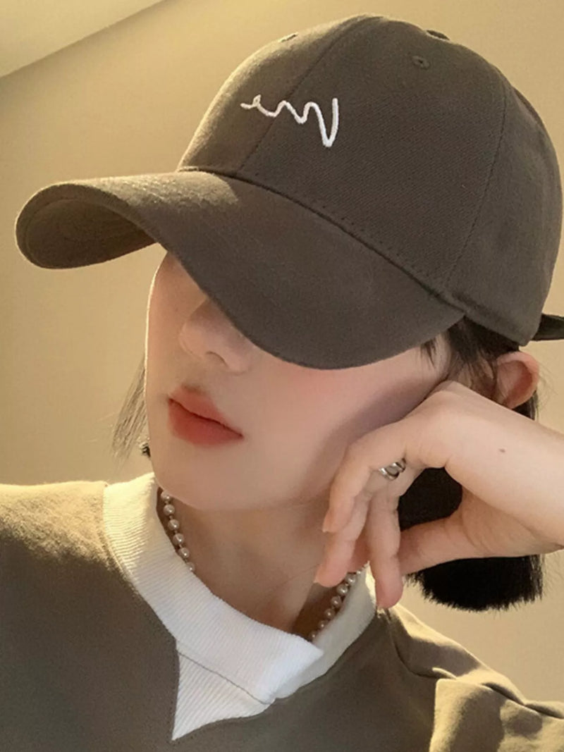 Monarch Millinery wave embroidered baseball cap on model