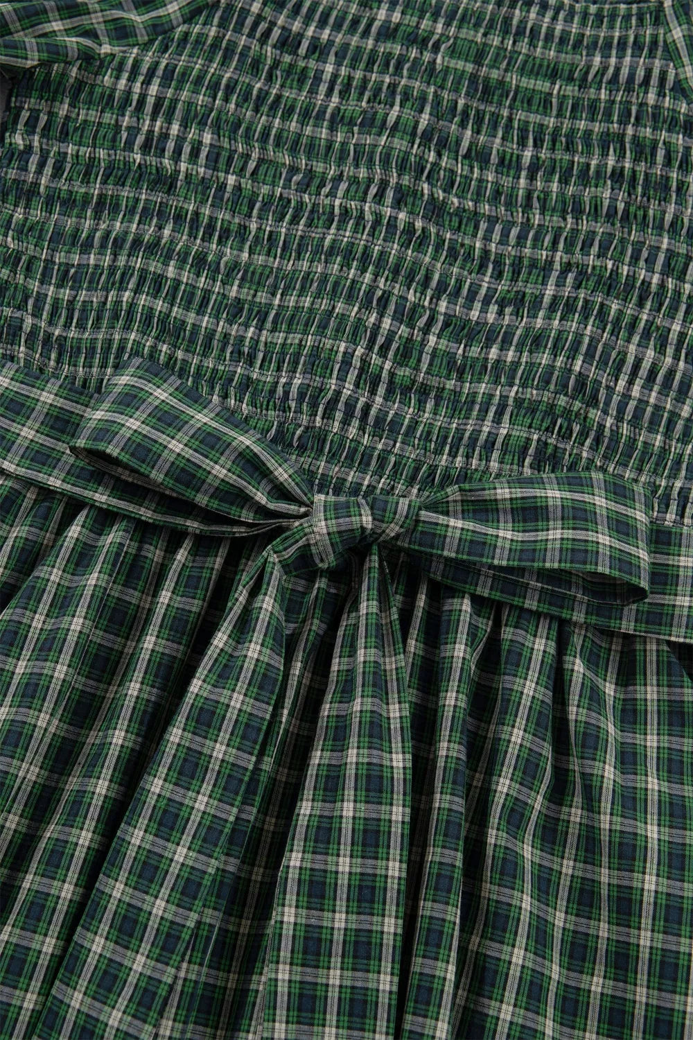 Tie detail at the bodice of the plaid maxi dress