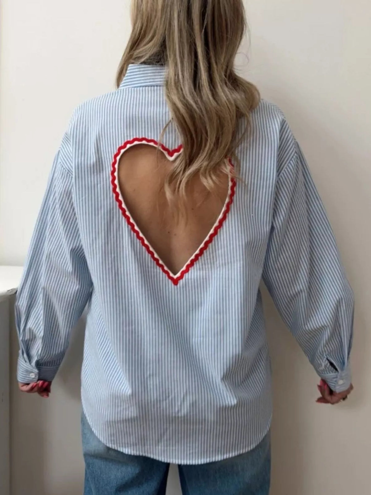 Blue striped button down shirt shown from the back