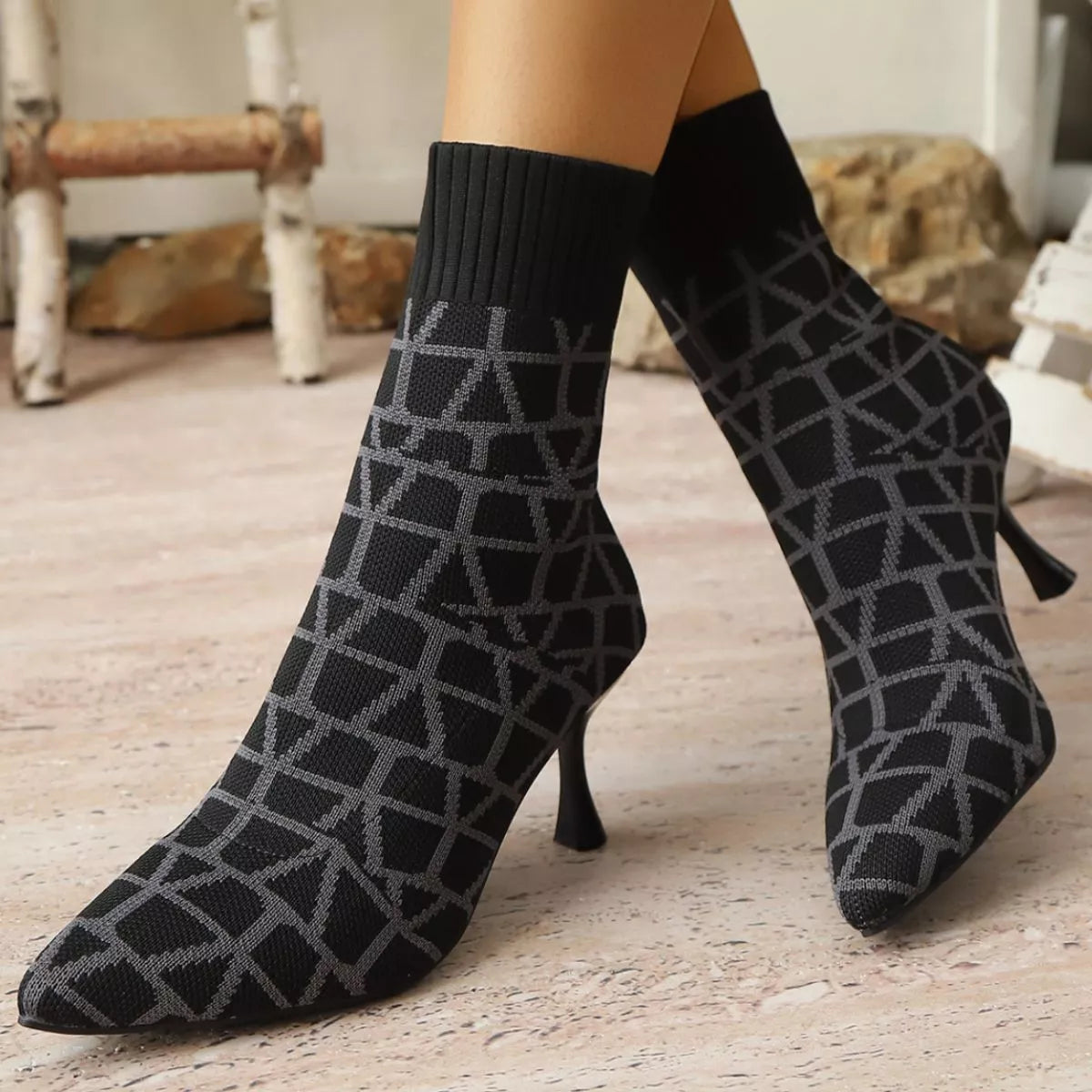 Red point toe flared heel boots front facing view