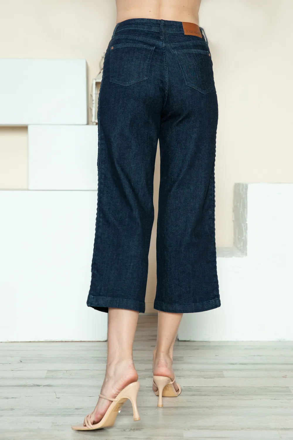 Crop wide leg jeans side view showing braid detail