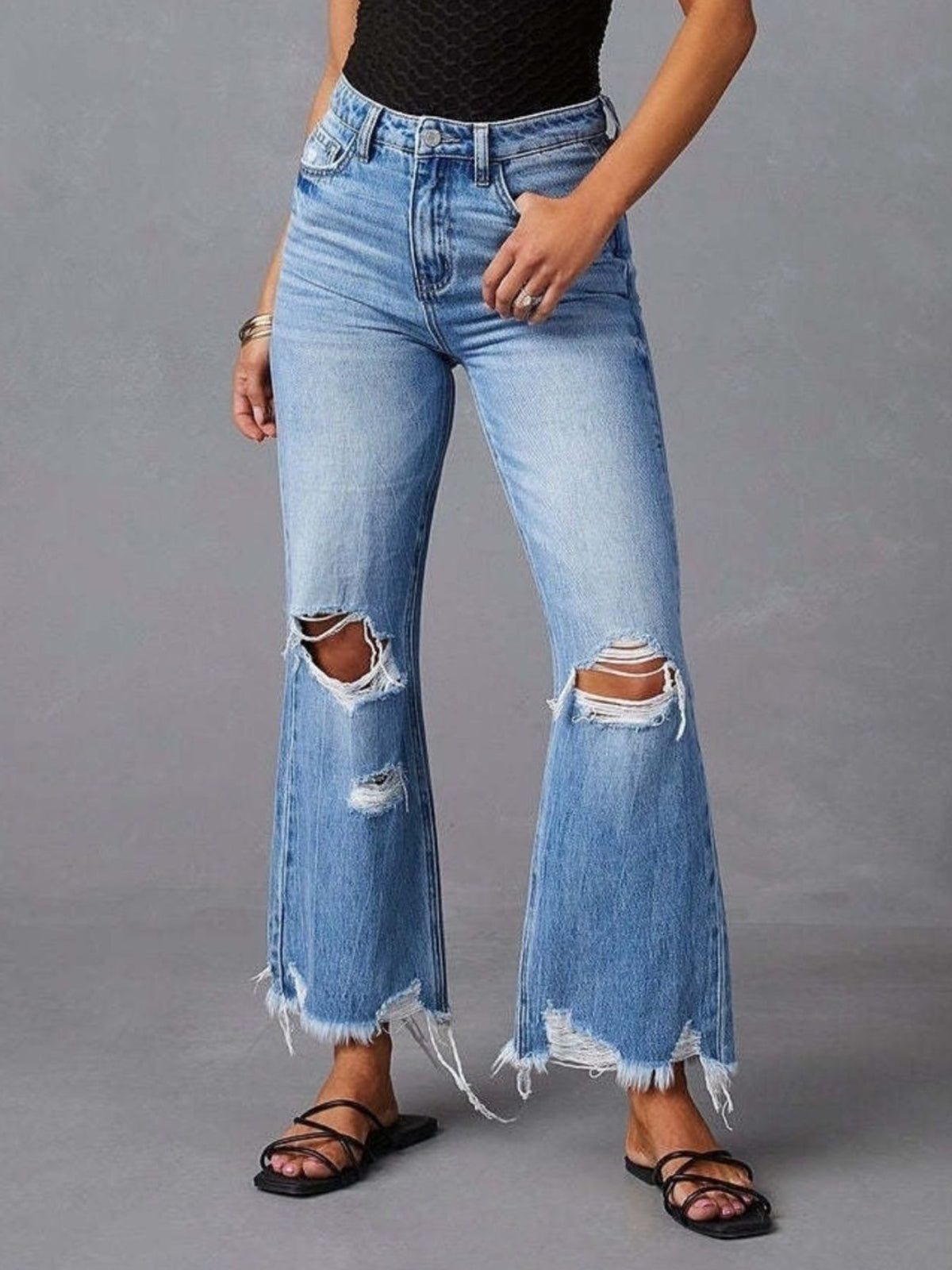 Distressed raw hem flare jeans front view