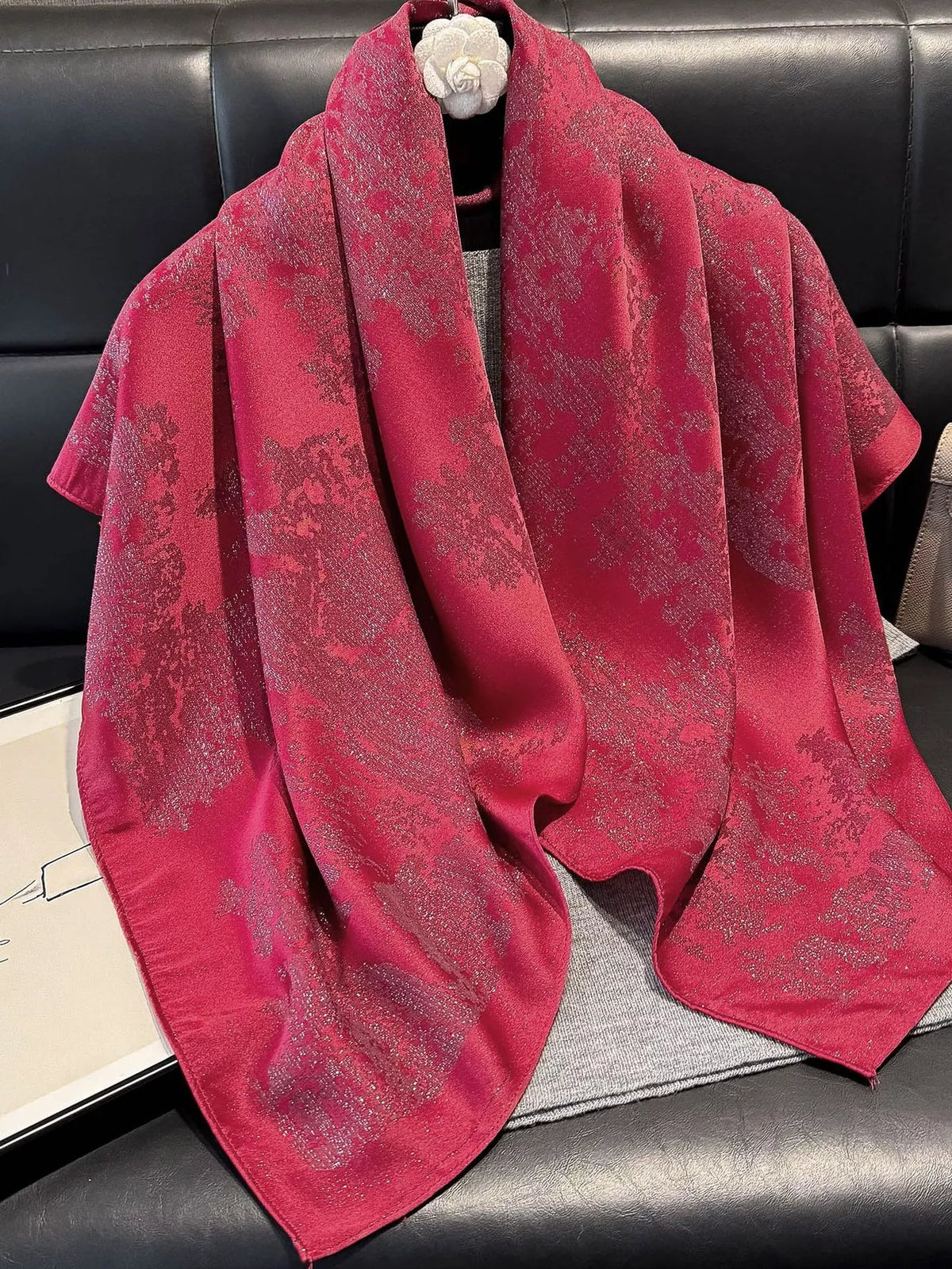 Lightweight scarf draped over shoulders