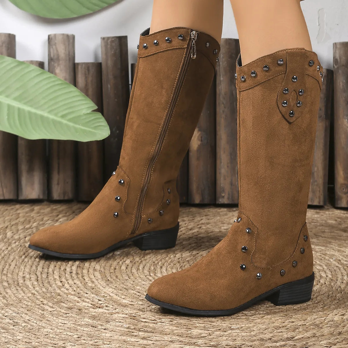 Studded mid calf boots styled with denim