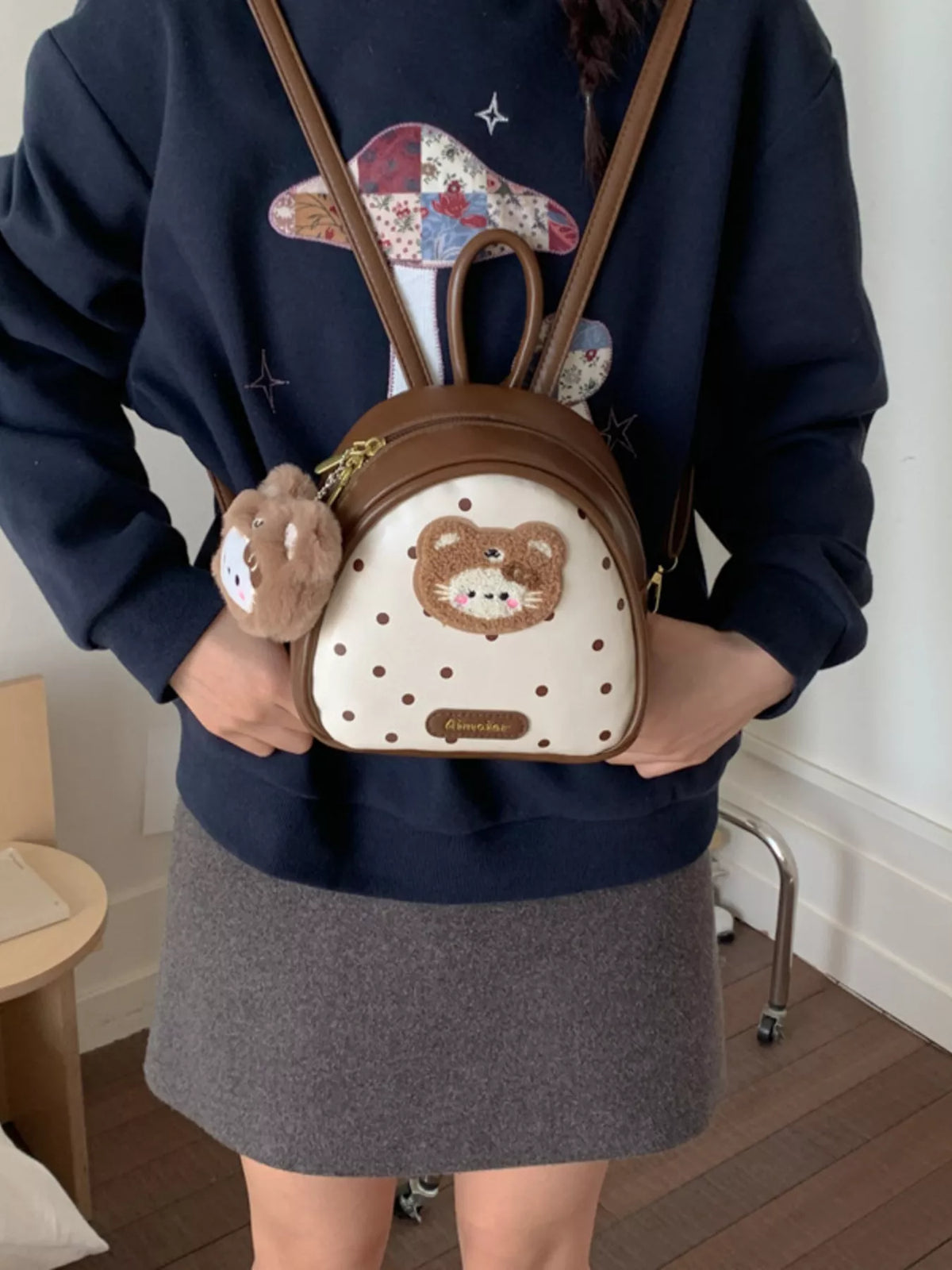 Brown cartoon bear mini backpack close up of the material