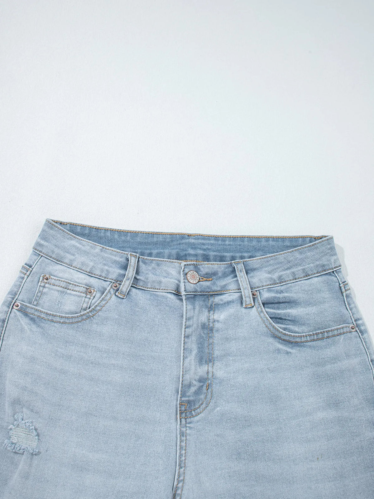 Denim texture on distressed skinny jeans