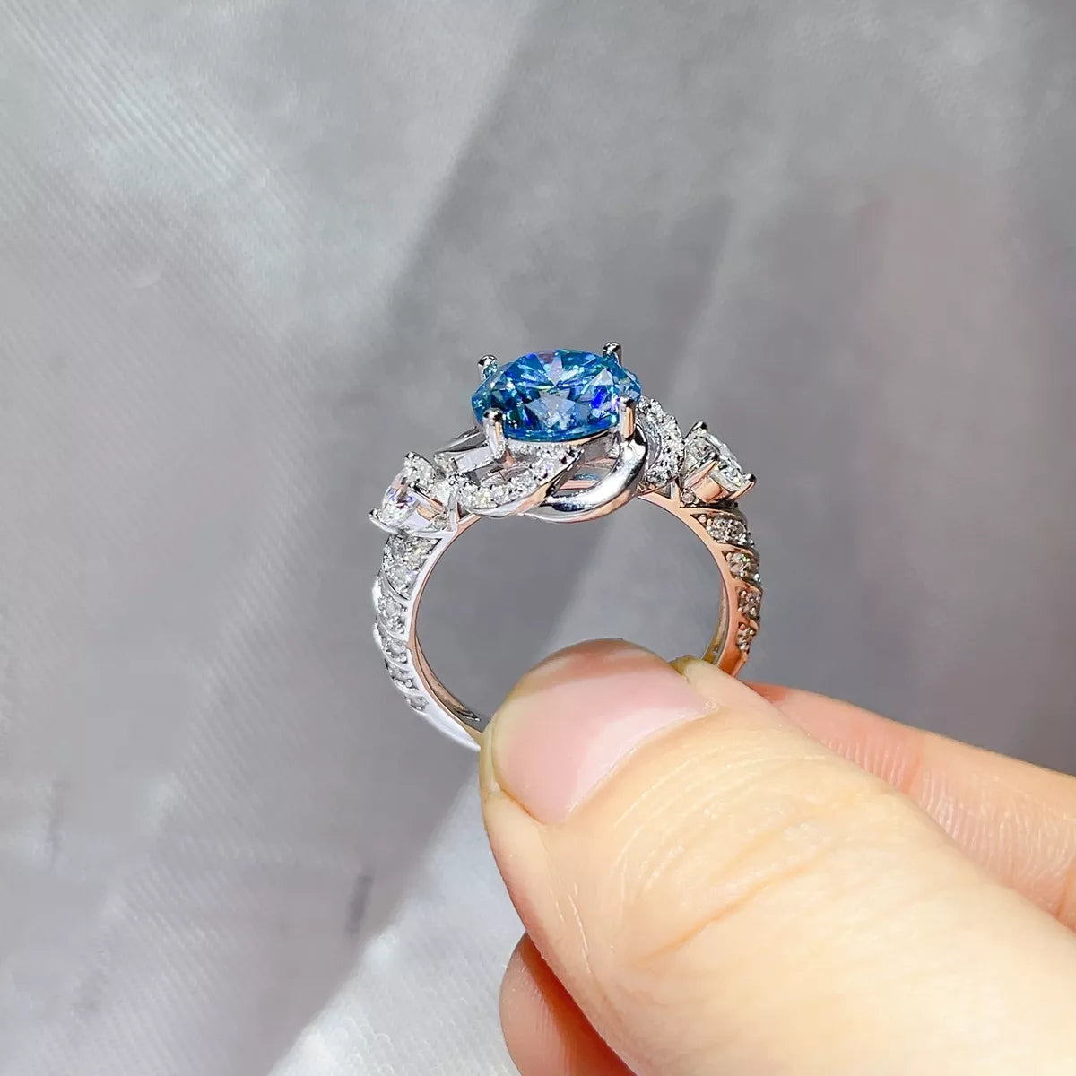 The blue moissanite ring shown on the hand