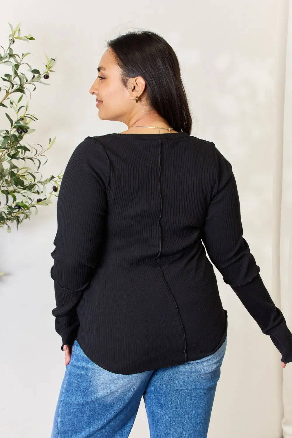 Side view showing the fitted ribbed knit