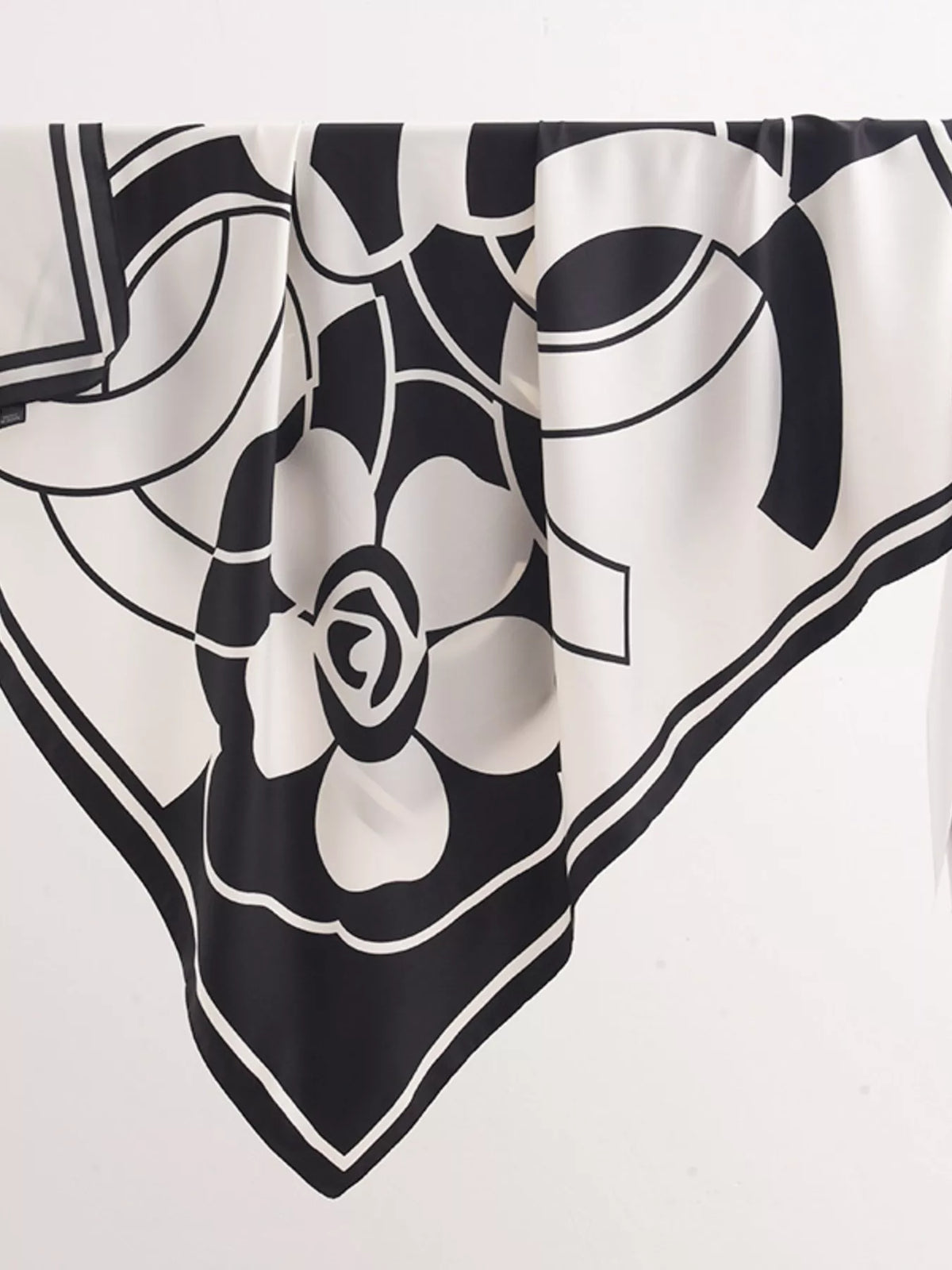 Close up of the blossom print on the silky scarf