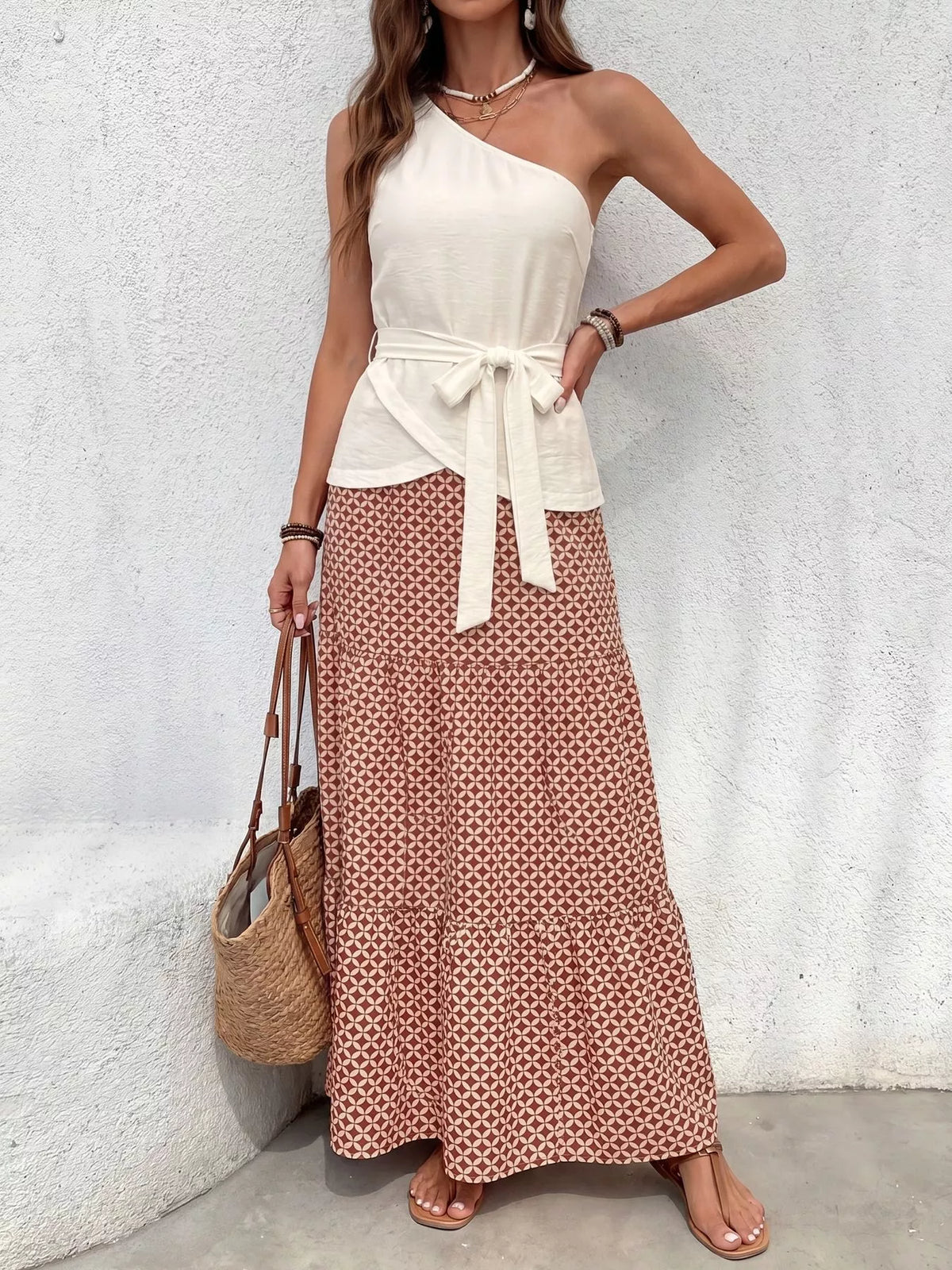 Cream one shoulder top and geometric print maxi skirt set front view