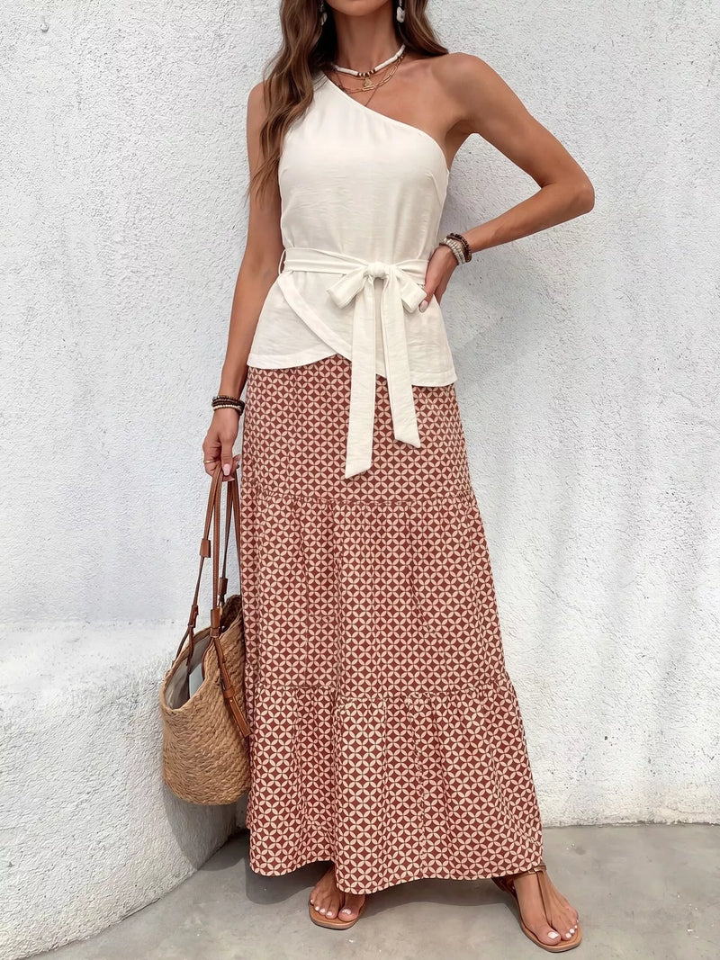 Cream one shoulder top and geometric print maxi skirt set front view