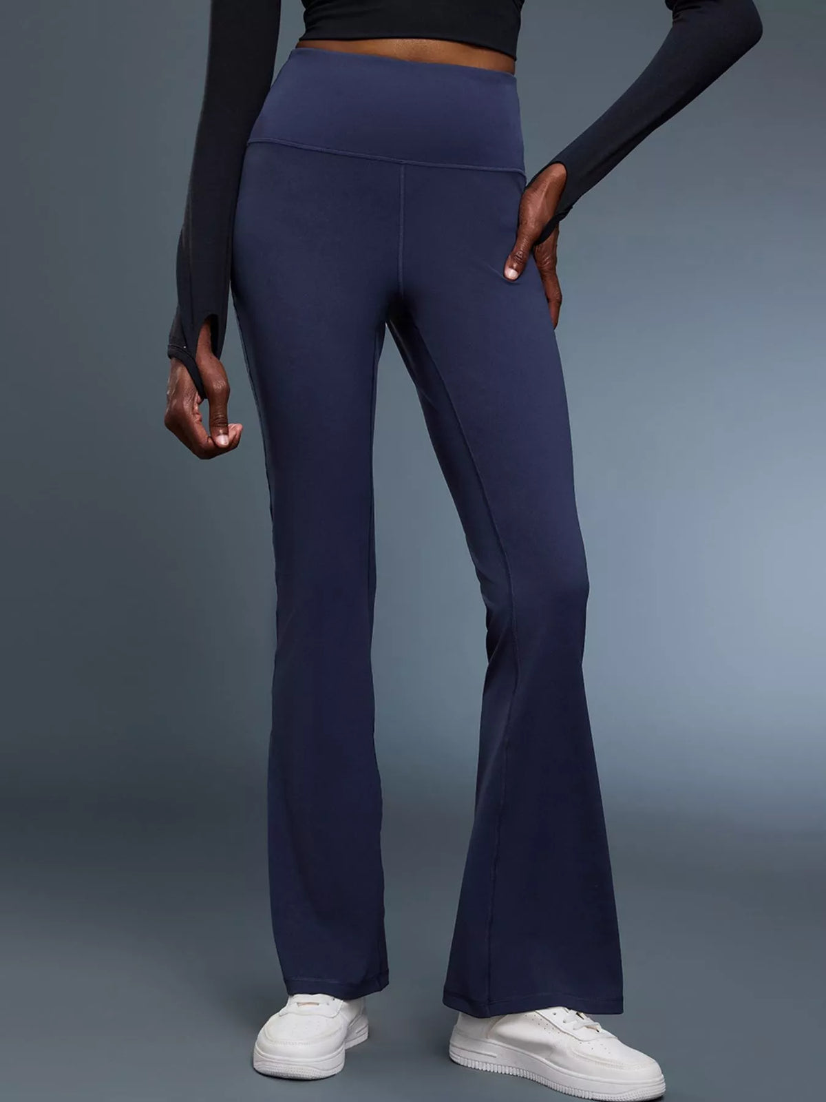 Flare active pants in burgundy on model
