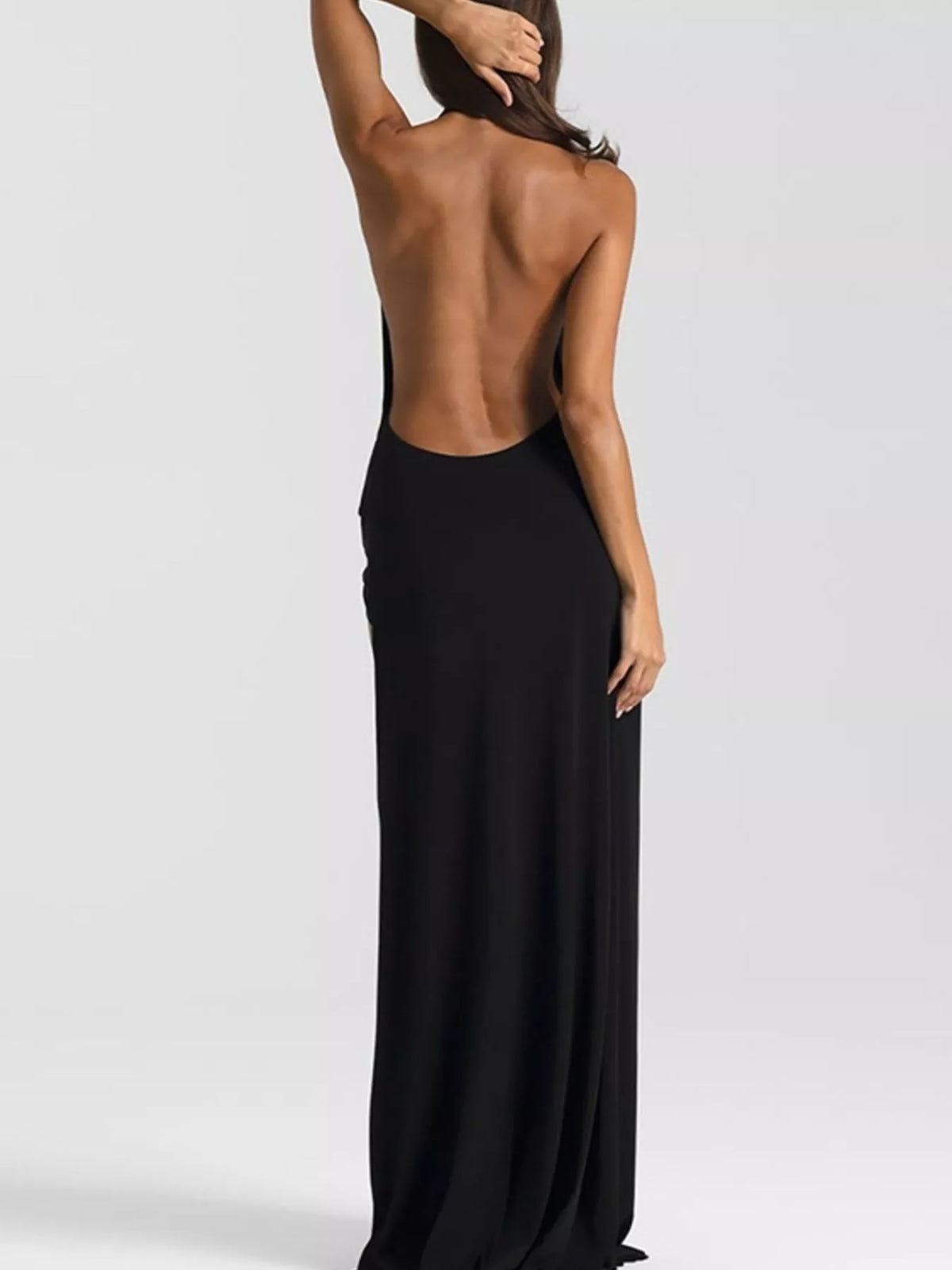 Yellow backless halter neck dress on model