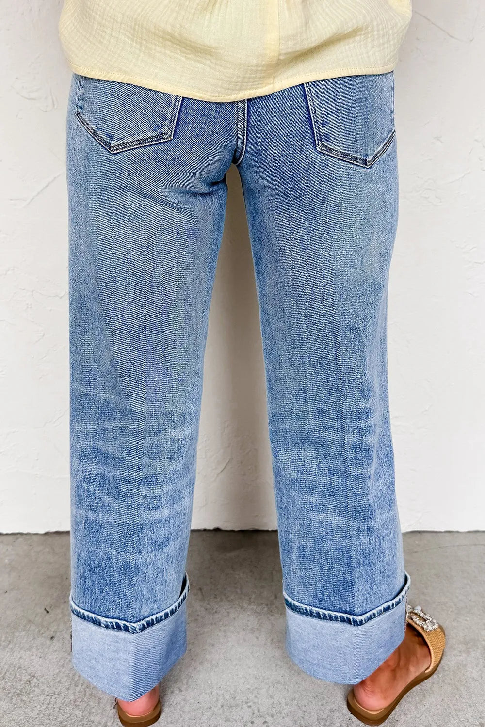 Back view of high waist wide leg cuffed jeans