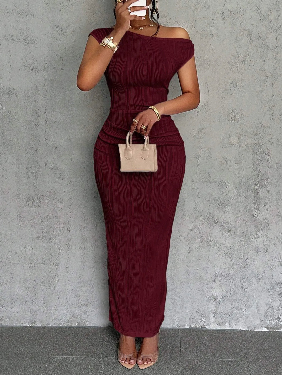 Asymmetrical one shoulder bodycon maxi dress hem detail